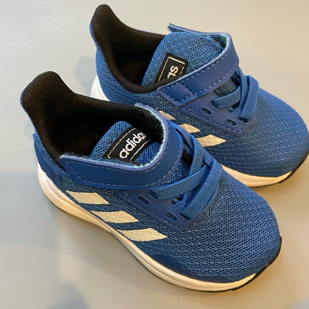 New never worn baby/toddler size 4 blue adidas sneaker.